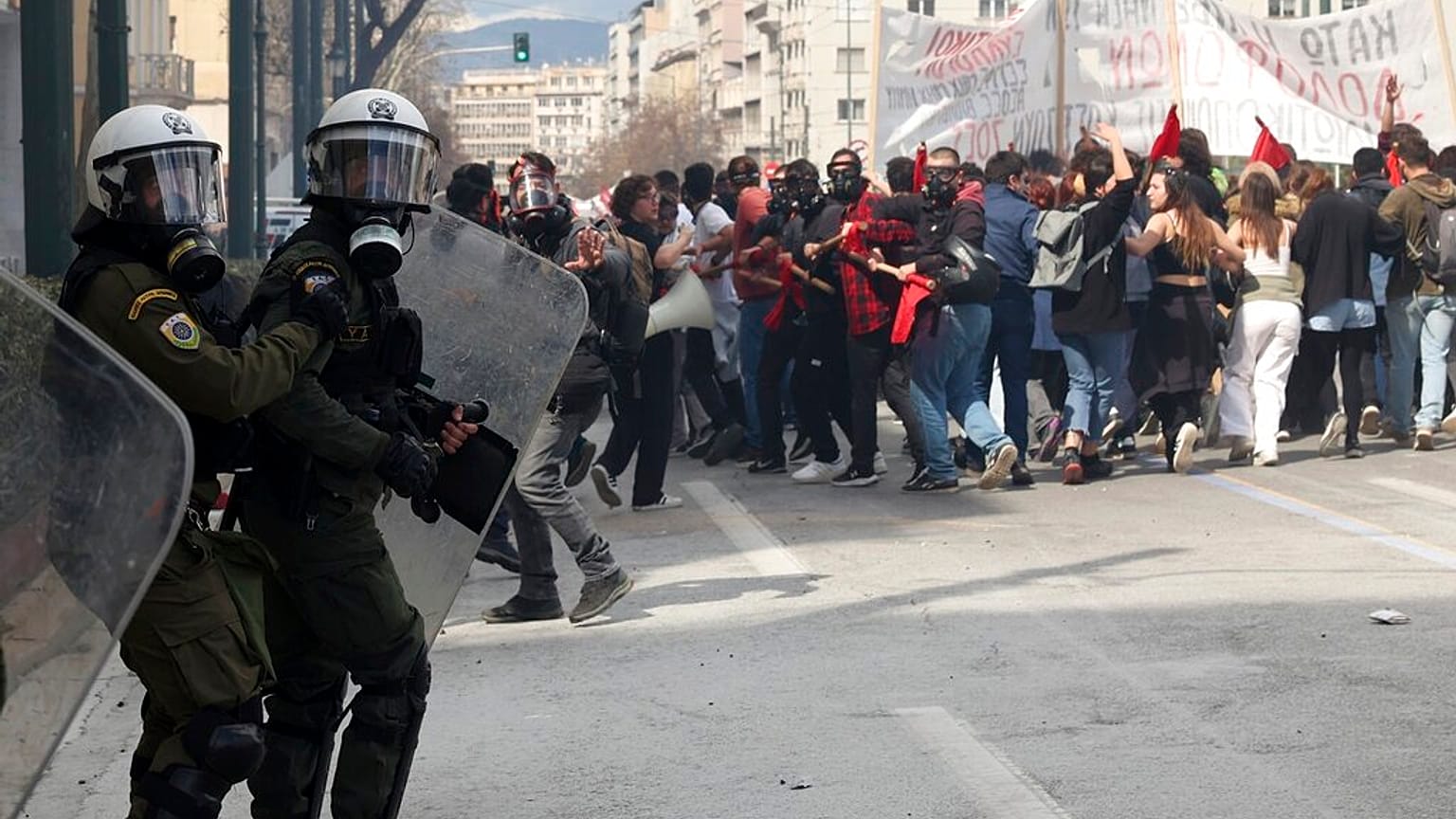 Riot police operate against demonstrators during clashes in Athens, Greece, Sunday, March 5, 2023.