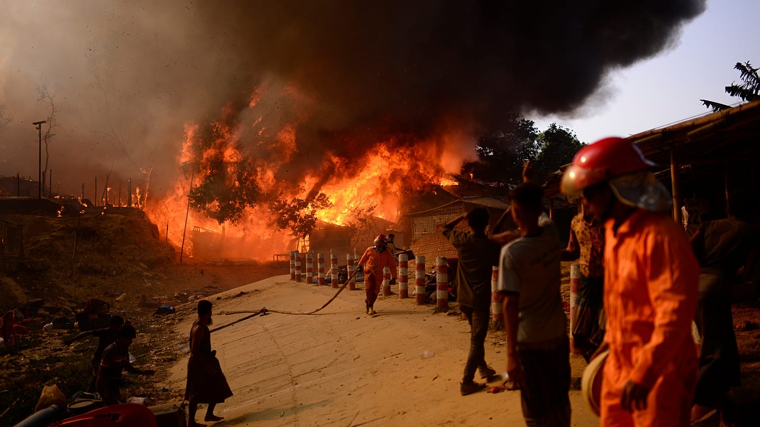 Fire personnel fight blaze at Rohingya refugee camp