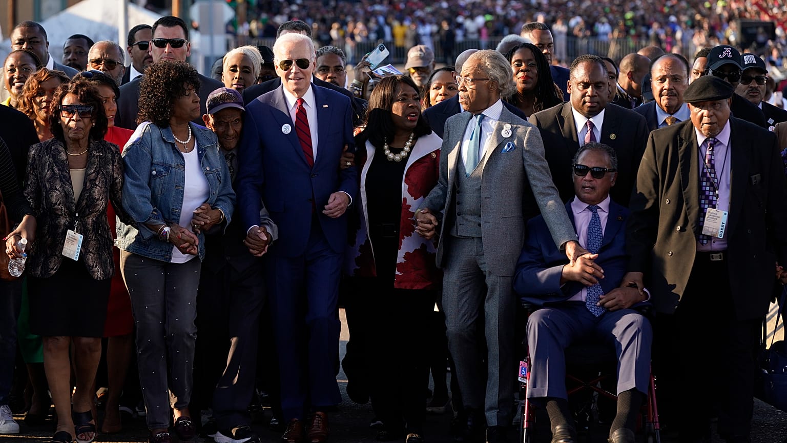 President Joe Biden prepares to walk across the Edmund Pettus Bridge in Selma, Alabama.