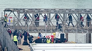 People believe to be migrants, onboard a Border Force vessel following a small boat incident in the Channel, England, Monday March 6, 2023.
