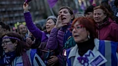 Protesters attend an International Women's Day demonstration in Madrid.