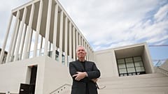 Architect David Alan Chipperfield poses outside of the James-Simon-Galerie at the 'Museumsinsel', Museums Island, in Berlin, Germany, on July 1, 2019. 