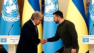 Ukrainian President Volodymyr Zelenskyy shakes hands with United Nations Secretary-General Antonio Guterres in Kyiv, Ukraine, March 8, 2023.