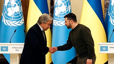 Ukrainian President Volodymyr Zelenskyy shakes hands with United Nations Secretary-General Antonio Guterres in Kyiv, Ukraine, March 8, 2023.