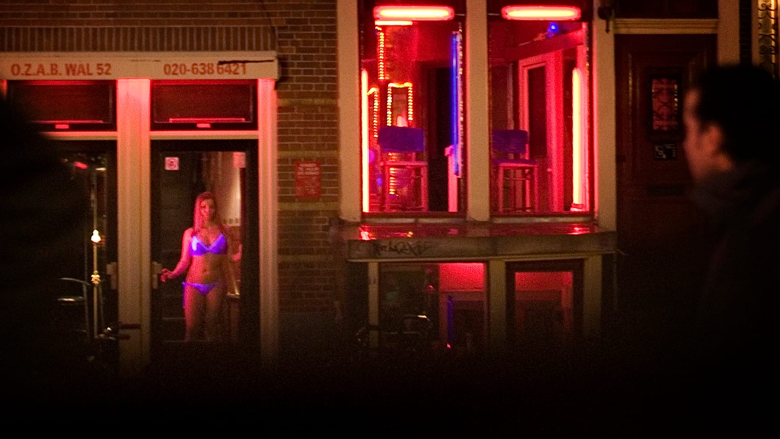 FILE: Sex workers are seen in the Red Light district of Amsterdam, Netherlands, Sunday, Dec. 7, 2008. 