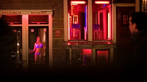 FILE: Sex workers are seen in the Red Light district of Amsterdam, Netherlands, Sunday, Dec. 7, 2008. 