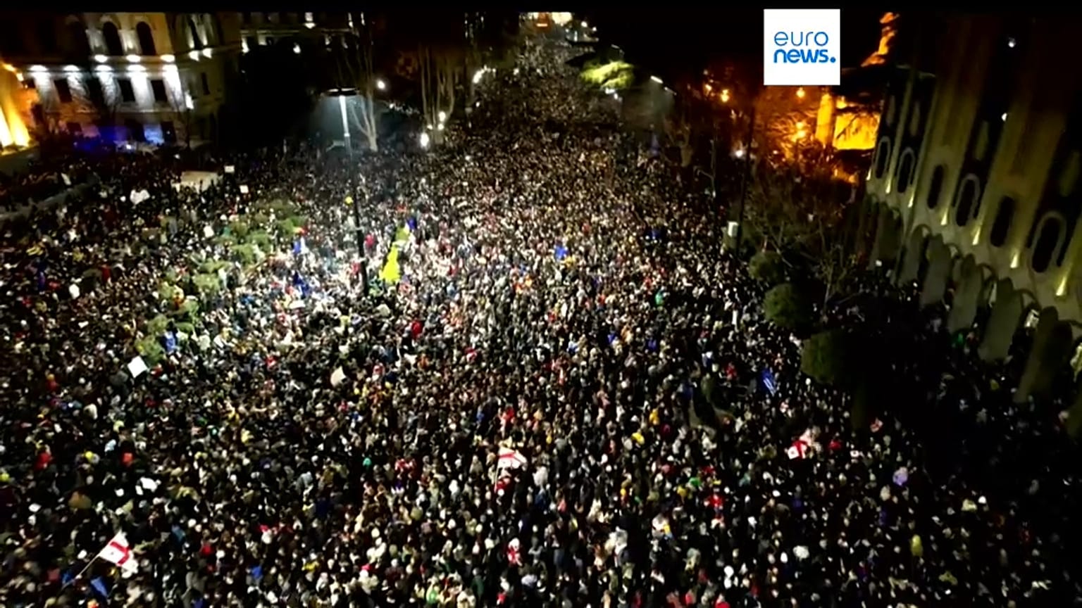 Protesters gather outside the Georgian parliament building in Tbilisi, Georgia.