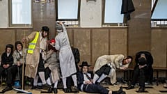 Ultra-Orthodox Jewish men celebrate after getting drunk during the Jewish holiday of Purim in Mea Shearim ultra-Orthodox neighborhood in Jerusalem, Wednesday, March 8, 2023.