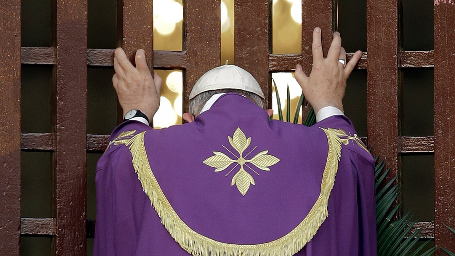 FILE — Pope Francis opens the holy door of the Bangui cathedral, Central African Republic, to open his yearlong Jubilee of Mercy, on Nov. 29, 2015.