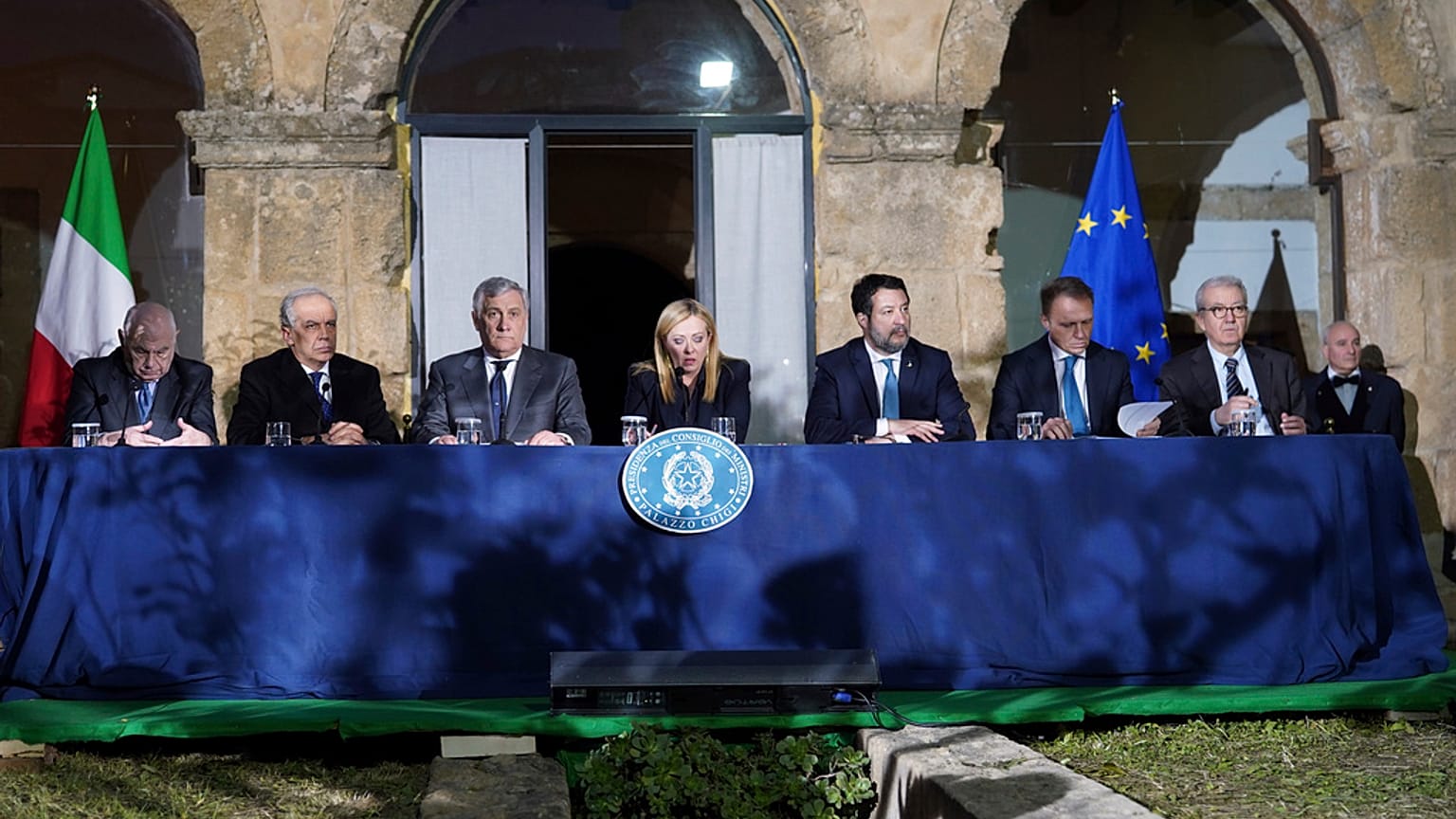 Italian Premier Giorgia Meloni, center, presides over a Cabinet session in Cutro's town council hall, southern Italy, Thursday, March 9, 2023. 