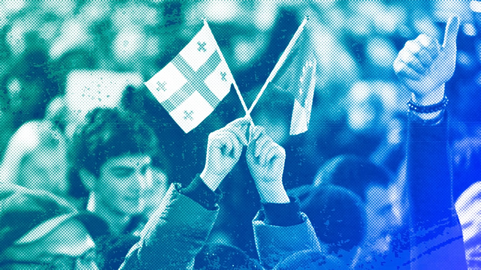 A young woman holds a Georgian national flag and an EU flag during a protest near the Georgian parliament building in Tbilisi, 9 March 2023