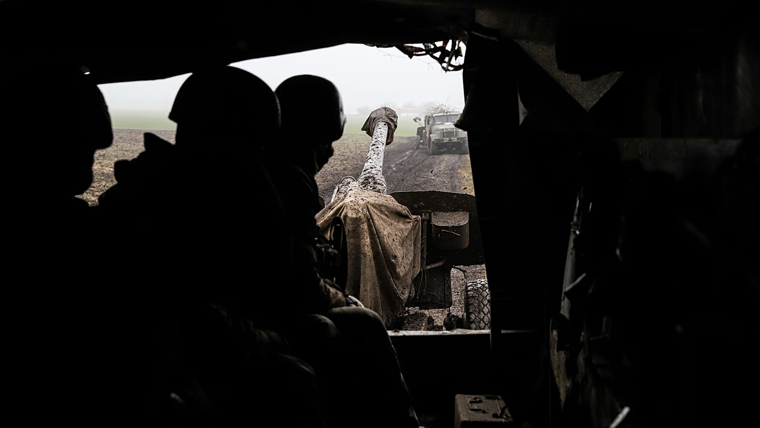 Ukrainian servicemen drive in a truck with artillery cannon Msta-B in Zaporizhzhia region in 2022. 