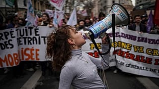 Students shout slogans during a protest in Lyon, central France, Thursday.