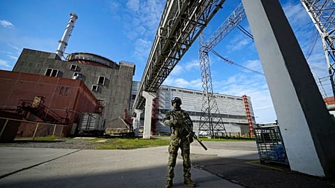 Russian serviceman guards an area of the Zaporizhzhia Nuclear Power Station in territory under Russian military control, southeastern Ukraine, May 1, 2022.