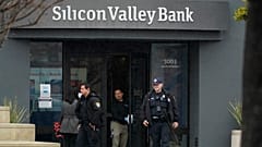 Santa Clara Police officers exit Silicon Valley Bank headquarters in Santa Clara, California, Friday, March 10, 2023, after it collapsed.