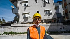 Ahmet Kandemir, a lawyer from antakya bar poses as he collects evidence frrom collapsed and damaged buildings in Hatay on March 7, 2023.