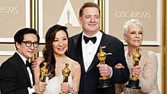 Ke Huy Quan, from left, Michelle Yeoh, Brendan Fraser and Jamie Lee Curtis pose with their awards in the press room at the Oscars 