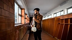 19 years old music student Ramiz from Afghanistan poses holding an Afghan instrument called rubab at the Music Conservatory of Braga, Portugal.