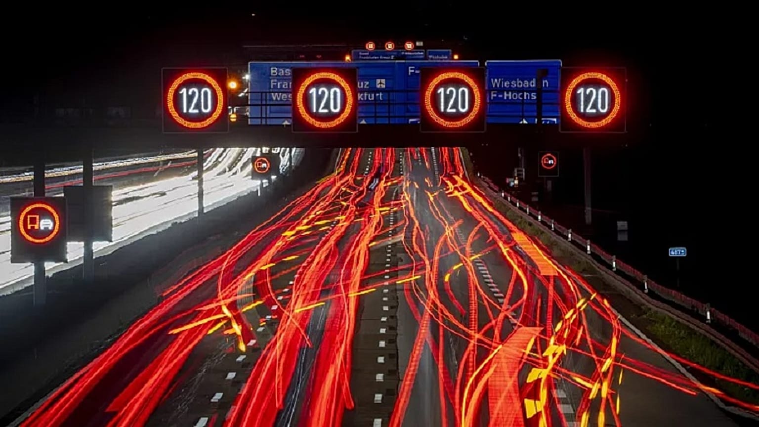A long exposure photo shows traffic moving along a highway in Frankfurt, Germany, Oct. 6, 2022.   
