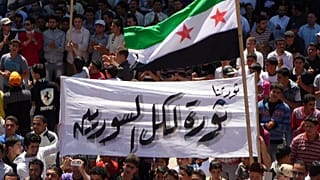 صورة من عام 2012 أثناء مظاهرة مناوئة لنظام السوري في إدلب 