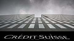 Grey clouds cover the sky over a building of the Credit Suisse bank in Zurich, Switzerland.
