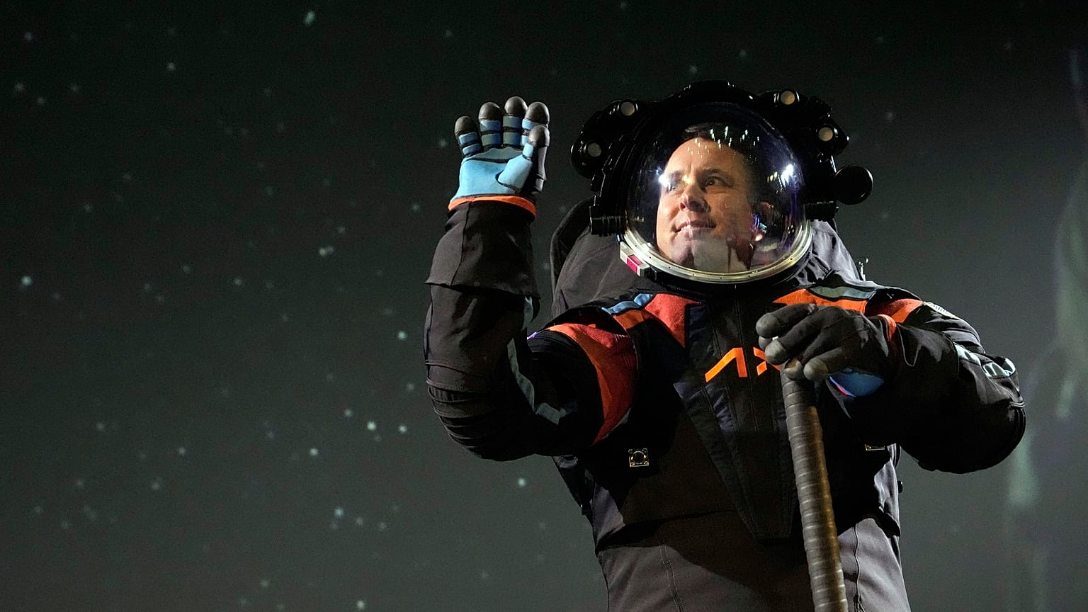 Axiom Space chief engineer Jim Stein demonstrates a prototype spacesuit, Wednesday, March 15, 2023, in Houston. 