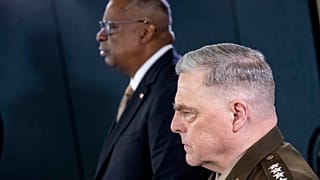 ecretary of Defense Lloyd Austin, left, accompanied by Chairman of the Joint Chiefs, Gen. Mark Milley, right in Washington, Wednesday, March 15, 2023. 
