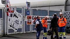 Municipality workers block the entrance of a waste incarnation plant in Paris, Friday, March 17, 2023. 