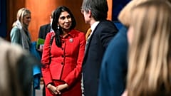 Britain's Home Secretary Suella Braverman speaks with members of the media after a press conference following the launch of new legislation on migrant channel crossings at Dow