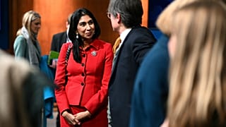 Britain's Home Secretary Suella Braverman speaks with members of the media after a press conference following the launch of new legislation on migrant channel crossings at Dow