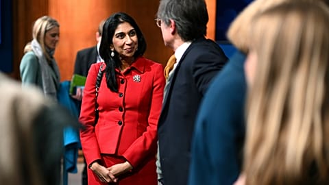 Britain's Home Secretary Suella Braverman speaks with members of the media after a press conference following the launch of new legislation on migrant channel crossings at Dow