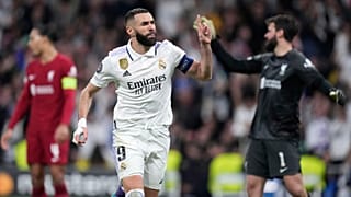 Real Madrid's Karim Benzema celebrates after scoring his sides first goal during the Champions League, round of 16, second leg soccer match between Real Madrid and Liverpool