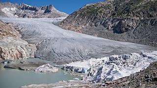 Parts of the Rhone Glacier are covered in blankets above Gletsch near the Furkapass in Switzerland, 13 July 2022.