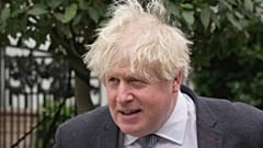 Former British Prime Minister Boris Johnson leaves his home, in London, Tuesday, March 21, 2023. (AP Photo/Kin Cheung)