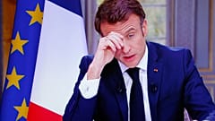 A drawing of French President Emmanuel Macron reading « Macron , we are not your buffoons» is pictured during a protest at Republique square in Paris, Tuesday, March 21, 2023.