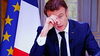 A drawing of French President Emmanuel Macron reading « Macron , we are not your buffoons» is pictured during a protest at Republique square in Paris, Tuesday, March 21, 2023.