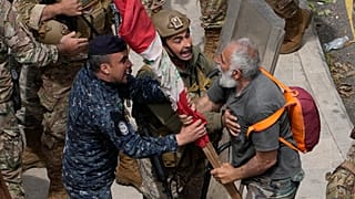 A retired army soldier arguing with Lebanese army and riot policeman, in Beirut, Lebanon, Wednesday, March 22, 2023