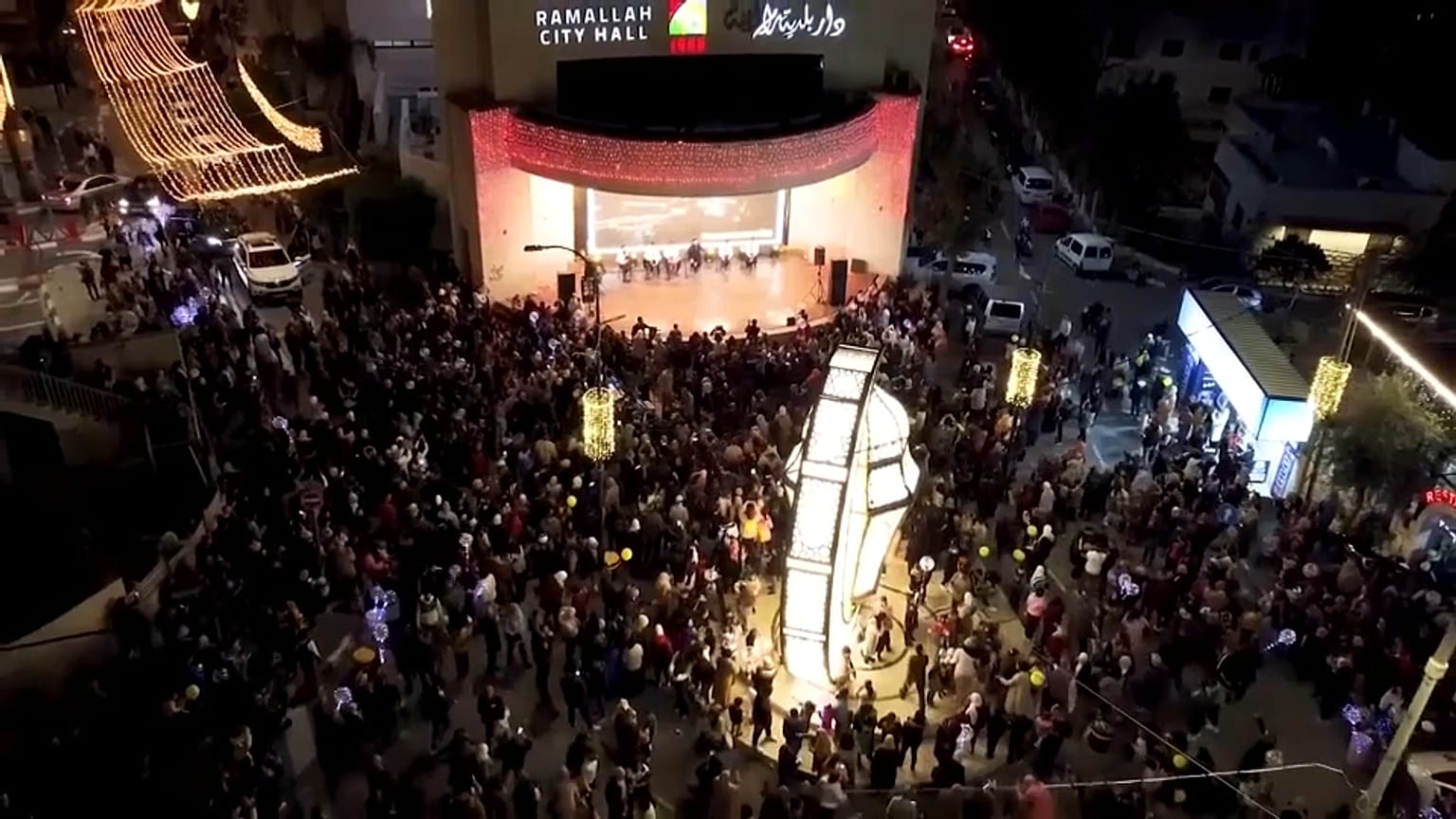 Palestinian Muslims gather in front of the City Hall in Ramallah in preparation for Ramadan