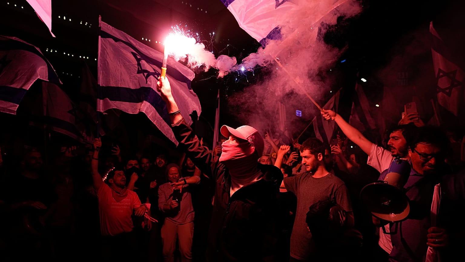 Israelis opposed to Prime Minister Benjamin Netanyahu's judicial overhaul plan block a highway during a protest