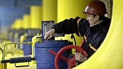 A Ukrainian worker operates valves in a gas storage and transit point in Boyarka, just outside Kyiv, Jan. 3, 2006