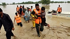 Army troops evacuate people from a flood-hit area in Punjab, Pakistan, last summer.