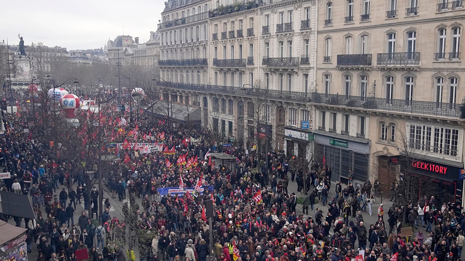 People march during a demonstration Tuesday, March 28, 2023 in Paris. Protests are taking place in France on Tuesday.