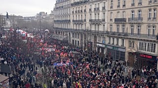 People march during a demonstration Tuesday, March 28, 2023 in Paris. Protests are taking place in France on Tuesday.