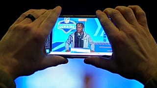 A journalist records Boston College wide receiver Zay Flowers as he speaks during a news conference in Indianapolis, Friday, March 3, 2023.