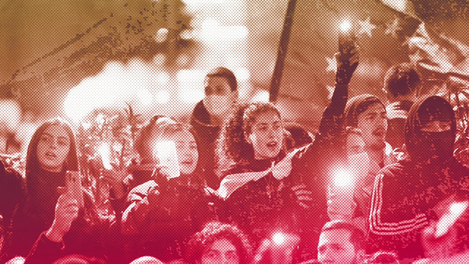 Protesters listen to a speaker during a rally near the Georgian parliament building in Tbilisi, 9 March 2023