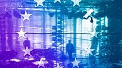The European flag at the European Parliament building in Strasbourg and a surveillance camera
