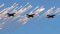 FILE - Belarusian army Su-25 jet fighters during a parade on Independence Day in Minsk, July 3, 2019. 