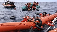 Migrants being rescued by a Sea Watch-3 team, around 35 miles away from Libya in Libyan SAR zone, Oct. 18, 2021. 
