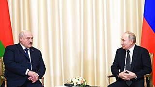 Russian President Vladimir Putin, right, and Belarusian President Alexander Lukashenko talk at a meeting in Russia in February, 2023.