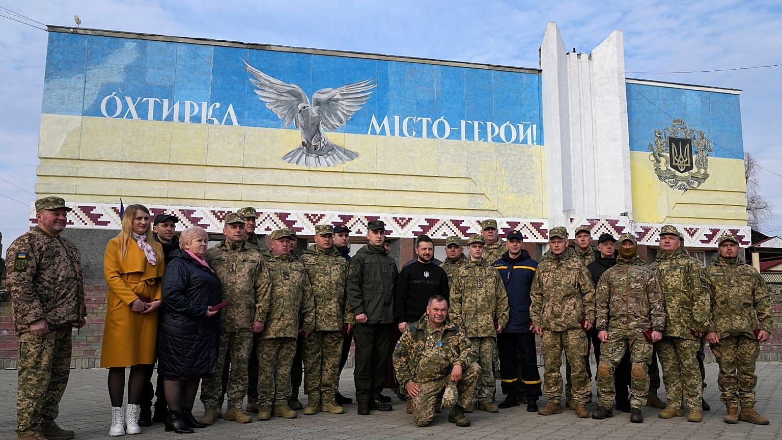 President Volodymyr Zelenskyy poses for a photo with military personnel, police officers and civilians during a visit to Okhtyrka in the Sumy region of Ukraine, Mar 28 2023